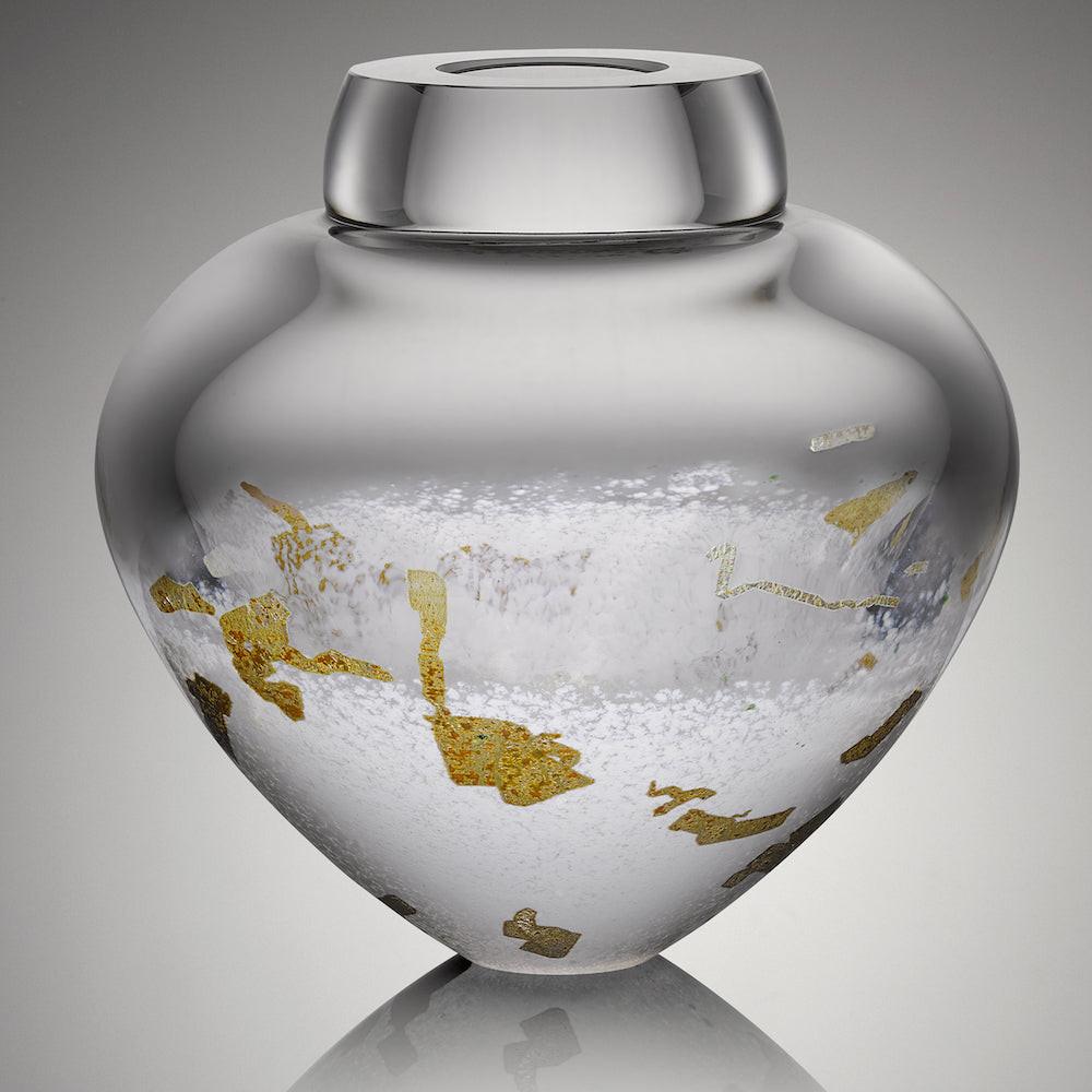 A contemporary art glass bowl with white and gold accents and a cut and polished lip. Handblown glass art for the modern home and office.